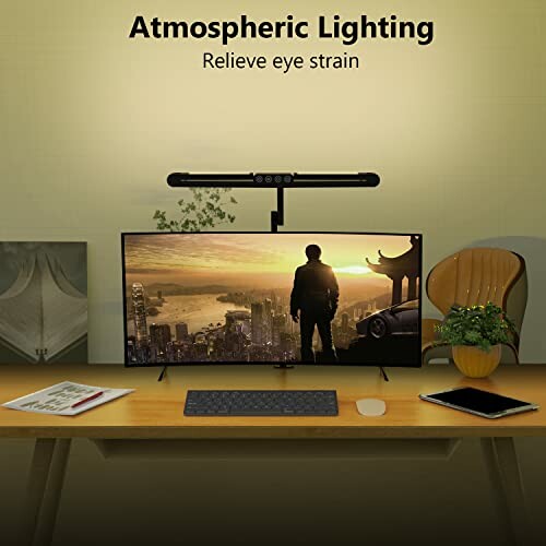 Desk setup with monitor and atmospheric lighting bar. The Micomlan Led Desk Lamp provides a warm and cozy glow.
