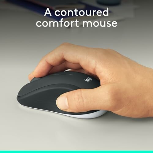 Hand using a contoured comfort mouse on a desk.
