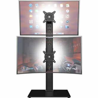Dual monitor stand with screens displaying apps and a game