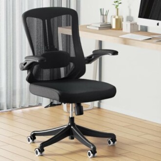 Black ergonomic office chair in a modern workspace