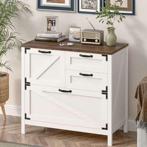 White cabinet with drawers, vintage radio, and decor items.