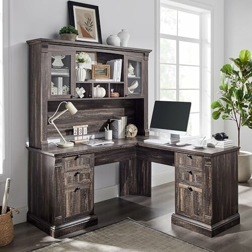 L-shaped wooden office desk with hutch and computer setup